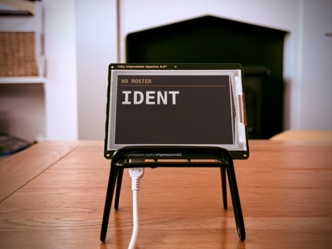A 4.0 inch Ident on a desk stand showing NO ROSTER before setup